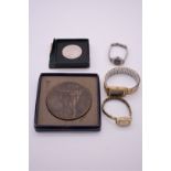 Three ladies wristwatches; together with a cased WWI Cenotaph Armistice bronze medal, 11th