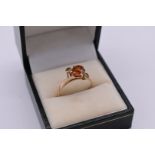 *WITHDRAWN FROM SALE* A cinnamon garnet and white sapphire dress ring, unmarked, 3.2g total weight.