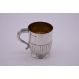 A silver Christening mug, by Elkington & Co Ltd, Birmingham 1911, gilt lined, 9cm high, 199g.