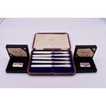 Two cased limited edition Singapore Airlines .800 ingots; together with a cased set of silver