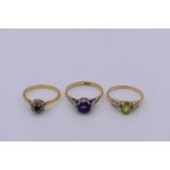 Three gem set gold dress rings, hallmarked/stamped 18ct, 7.8g total weight.