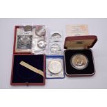 Coins: a cased Finland silver 10 Markaa; together with a cased Sierra Leone silver one Leone,