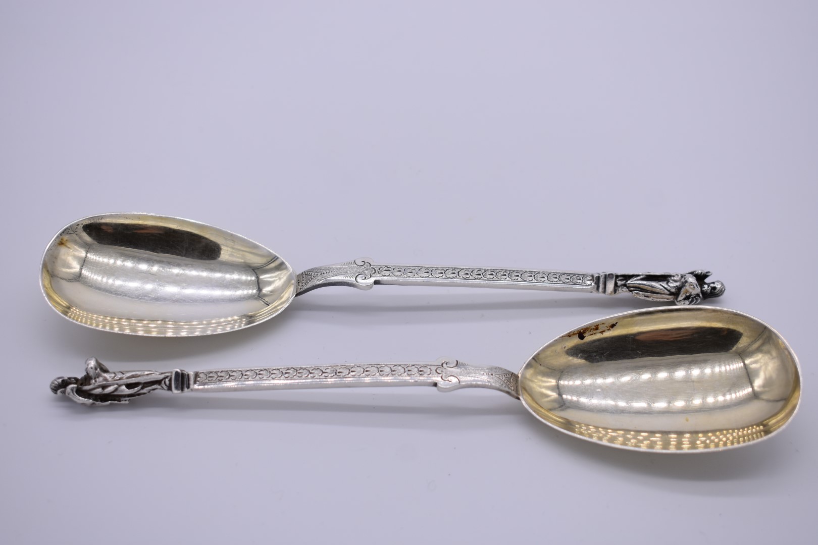 A pair of Victorian silver and gilt apostle serving spoons, by Sibray, Hall & Co (Job Frank Hall),