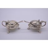 A pair of silver mustards, by Horace Woodward & Co Ltd , London 1910, 227g.