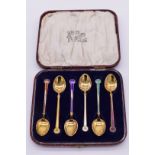 A cased set of six sterling gilt and coloured enamel coffee spoons, by David Anderson, Oslo 1925 -