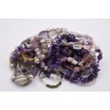 A selection of silver and other jewellery, set tumbled and carved amethyst and glass beads.