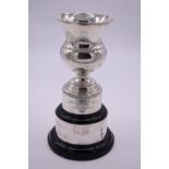 A silver baluster trophy, by Carrington & Co, London 1925, on stand 14.5cm high, 197g weighable.