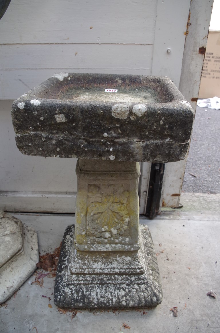 An old composition stone bird bath, 56cm high.