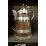 A late 19th century oak and electroplate mounted ale or cider jug, with replacement lid, total