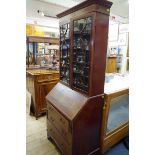 An Edwardian mahogany and inlaid bureau bookcase, 80.5cm wide.