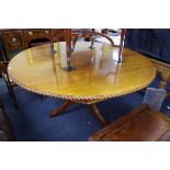 A mahogany circular breakfast table, with gadrooned edge, on spiral reeded column with tripod