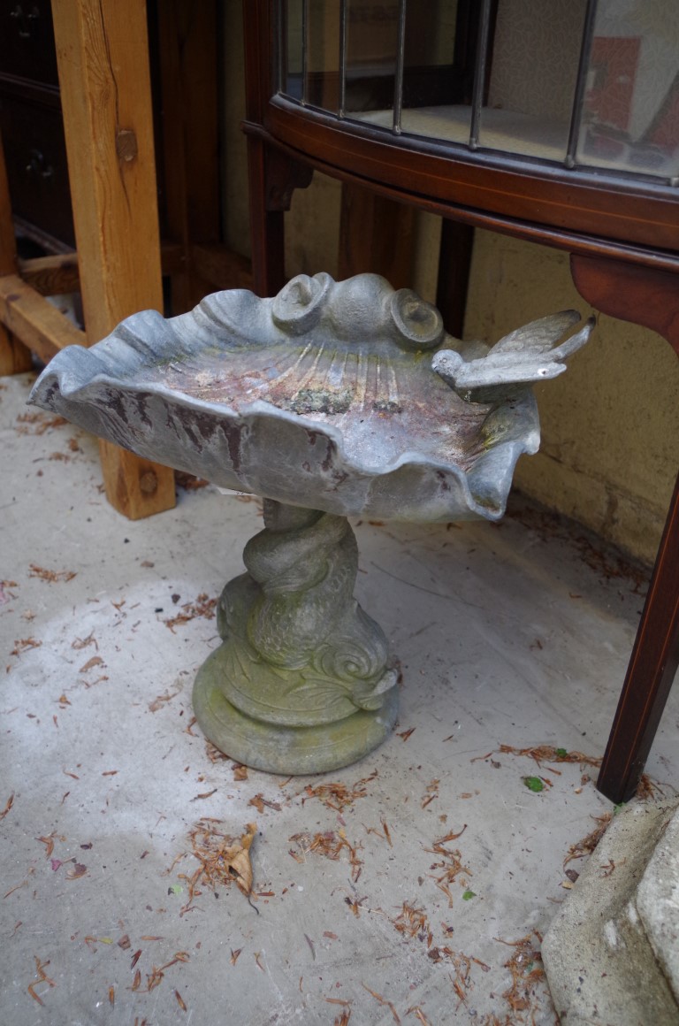 A lead shell pedestal bird bath, 37.5cm high.