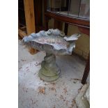 A lead shell pedestal bird bath, 37.5cm high.