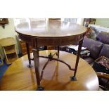 A circa 1900 flame mahogany and inlaid circular centre table, with segmented veneer top above a