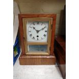 A late 19th century American walnut mantel 30 hour timepiece, labelled '...The E.N Welch