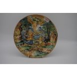 A Renaissance style maiolica dish, possibly 17th century, painted with figures in a landscape,