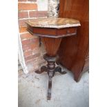 A Victorian octagonal chequerboard inlaid tripod work table, 45cm wide.