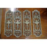 A set of four neoclassical style cast and pierced brass door plates, 27 x 8cm.