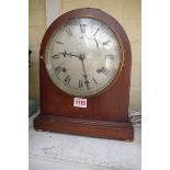 An Edwardian mahogany and inlaid dome top mantel clock, 29.5cm high; together with an oak aneroid