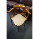 A pair of Edwardian mahogany and inlaid corner salon chairs; together with a similar Sutherland