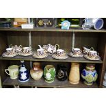 A Royal Crown Derby Imari tea service, pattern 2451, comprising: teapot & cover; sucrier & cover;