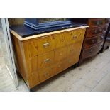 A Biedermeier birch and ebonized commode, 108cm wide.