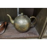 A 19th century Indian brass teapot, with white metal stylized decoration, 16cm high.