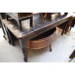 A stained pine kitchen table, with a lateral frieze drawer, 182cm long.