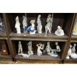 Twelve Lladro porcelain figures, largest 25cm high.