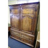 An oak press cupboard, comprising 18th century elements, enclosing hanging space, 148.5cm wide.