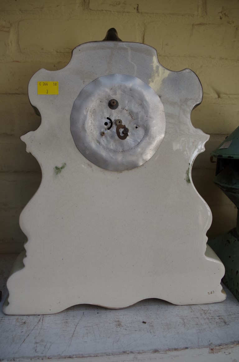 An old pottery mantel timepiece, 42cm high. - Image 2 of 2