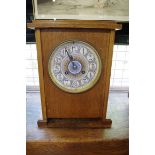 A late 19th century Aesthetic oak mantel clock, attributed to Lewis Foreman Day, with painted 6in