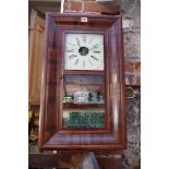 A 19th century American rosewood wall clock, by E.N Welch, 66cm high, with pendulum, (dial door