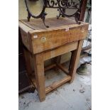 An old butcher's block, on pine stand, 60.5cm wide.
