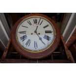 An oak circular wall clock, with 12in painted dial, with pendulum and winding key.