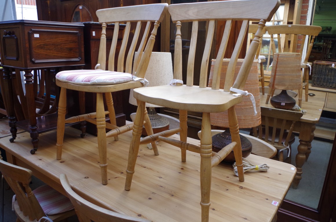 A pine kitchen table and six beechwood chairs, the table with opposing lateral frieze drawers, 167cm - Image 2 of 2