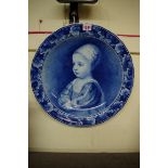 A Dutch Delft blue and white charger, painted with James II as a child, after Anthony Van Dyck, 41.