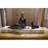 An Art Deco bronzed and onyx figure group, 60 cm wide.