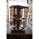 A reproduction mahogany and inlaid dwarf revolving bookcase, 43cm wide.