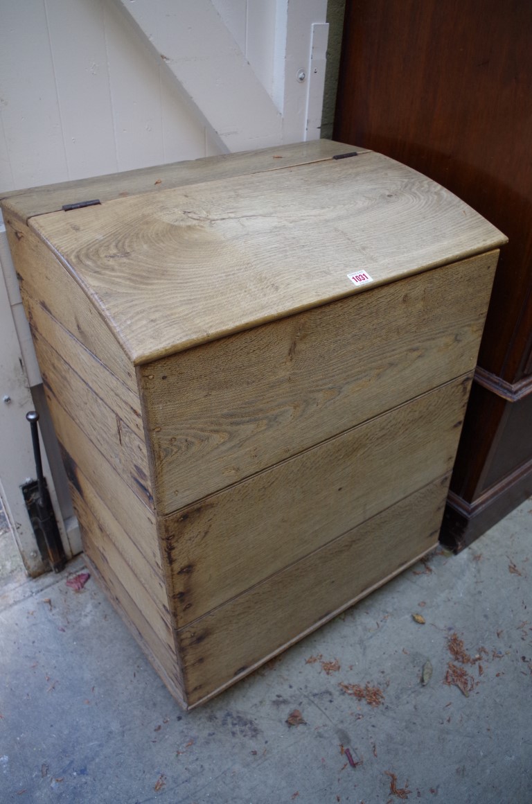 An old oak log bin, with hinged top, 64cm wide.