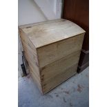 An old oak log bin, with hinged top, 64cm wide.