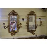 A pair of cast brass three branch girandole mirrors, 48cm high.