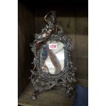 An antique cast metal frame easel back mirror, 34cm high.