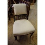 A pair of Victorian burr walnut and ebonized low occasional chairs.