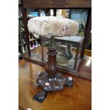 A Victorian rosewood adjustable piano stool.