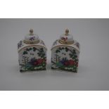 A small pair of Meissen tea canisters and covers, 9cm high, (finial of one restuck).