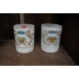 A pair of 19th century French opaline glass beakers, with painted and gilt decoration, 9.5cm high.