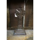 An Arts and Crafts carved bog oak celtic cross, 28cm high.
