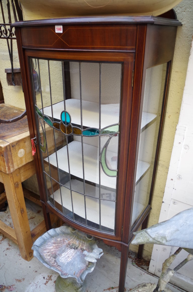 An Edwardian mahogany and line inlaid bowfront display cabinet, 61.5cm wide.