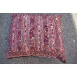 A large kilim saddle bag cushion, approx. 70 x 60cm.